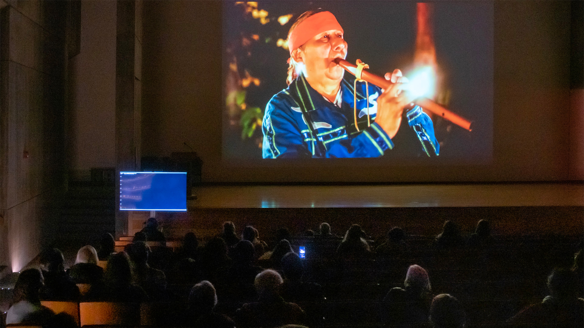 Documentation image of the film "Haudenosaunee Canoe Journey" projected in the Everson Museum's auditorium